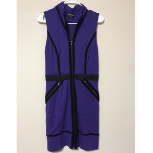 A bebe dress with zippers.